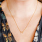 LINNY CO Sadie Bow Gold necklace for kids & little girls — hypoallergenic, waterproof stainless steel, shown on model.