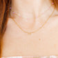 LINNY CO Sadie Bow Gold necklace for kids & little girls — hypoallergenic, waterproof stainless steel, shown on model.