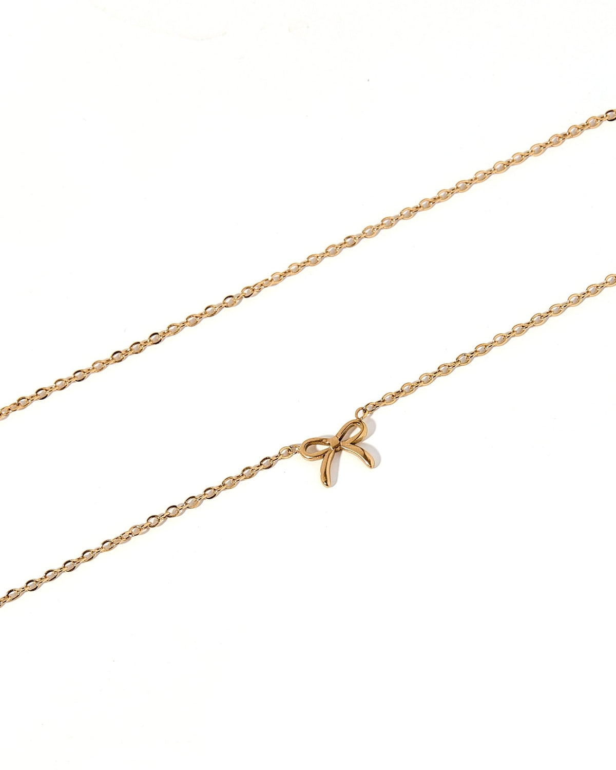 LINNY CO Sadie Bow Gold necklace for kids & little girls — hypoallergenic, waterproof stainless steel, detail.