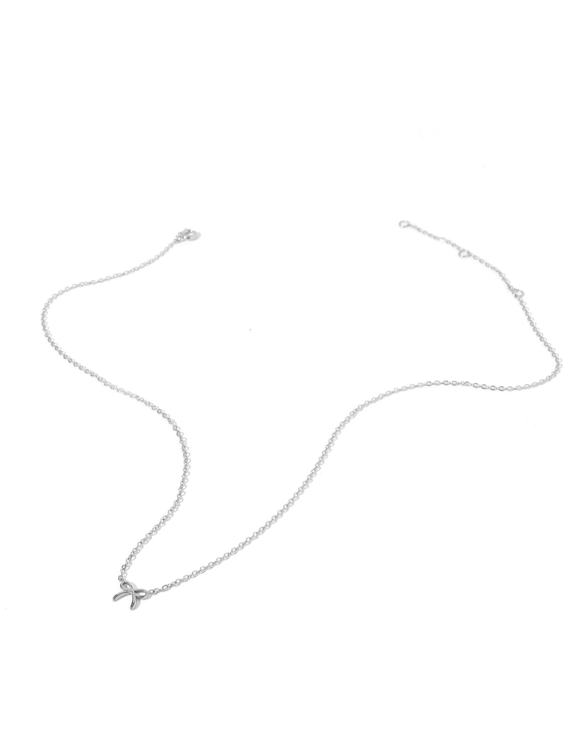 LINNY CO Sadie Bow Silver necklace for kids & little girls — hypoallergenic, waterproof stainless steel, detail.