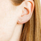 LINNY CO Abigail Pearl Gold screwback stud earrings for kids & little girls — hypoallergenic, waterproof stainless steel with secure screwback backs, shown on model.