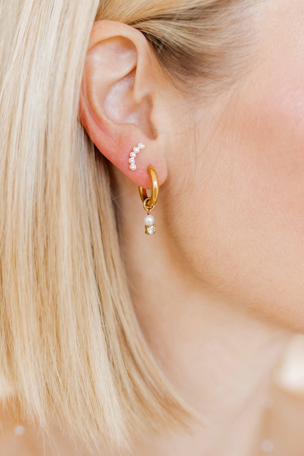 LINNY CO Abigail Pearl Gold screwback stud earrings for kids & little girls — hypoallergenic, waterproof stainless steel with secure screwback backs, shown on model.