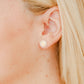 LINNY CO Alice Pearl screwback stud earrings for kids & little girls — hypoallergenic, waterproof stainless steel with secure screwback backs, shown on model.