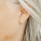 LINNY CO Alice Pearl screwback stud earrings for kids & little girls — hypoallergenic, waterproof stainless steel with secure screwback backs, shown on model.