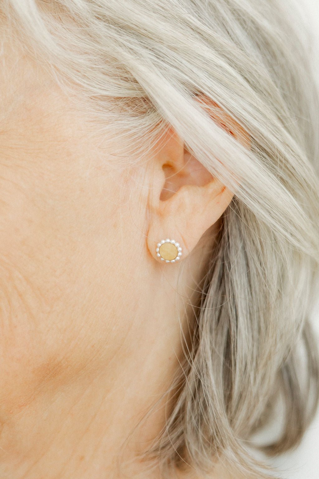 LINNY CO Alice Pearl screwback stud earrings for kids & little girls — hypoallergenic, waterproof stainless steel with secure screwback backs, shown on model.