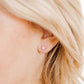 LINNY CO Alli Pink screwback stud earrings for kids & little girls — hypoallergenic, waterproof stainless steel with secure screwback backs, shown on model.
