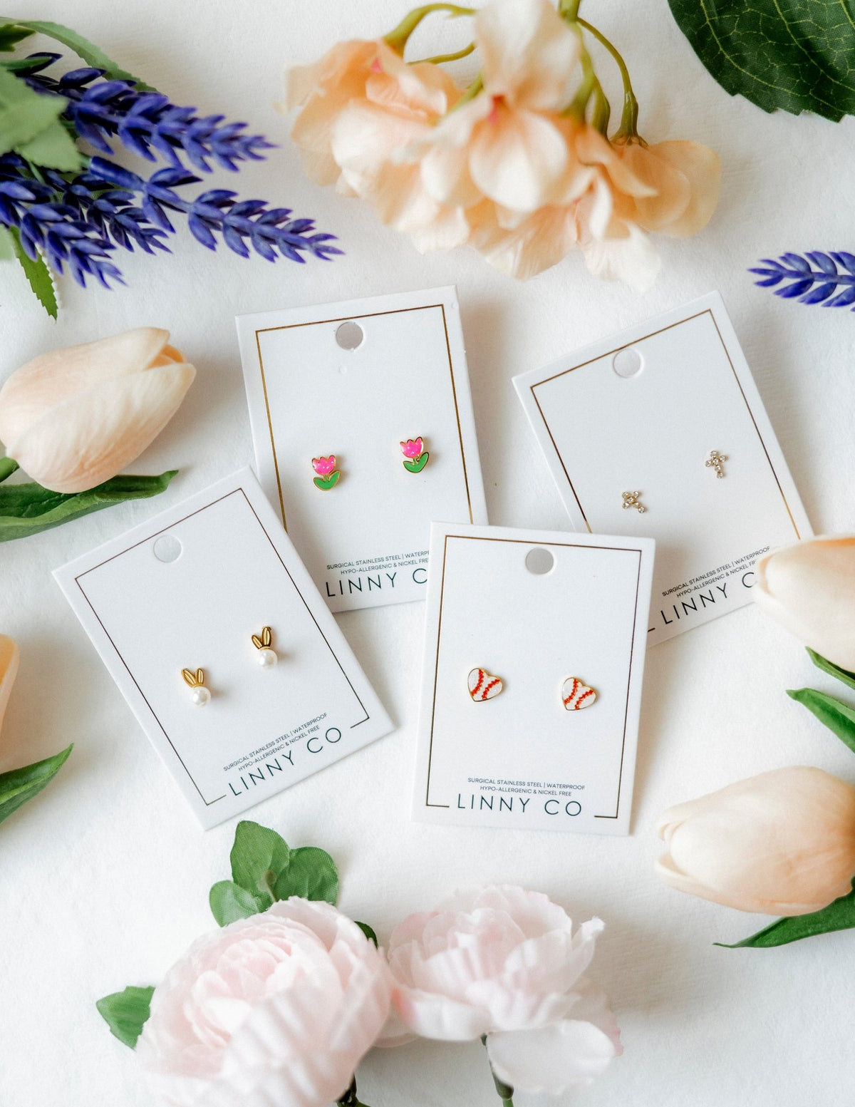 LINNY CO Baseball Gold screwback stud earrings for kids & little girls — hypoallergenic, waterproof stainless steel with secure screwback backs, flat-lay styling.
