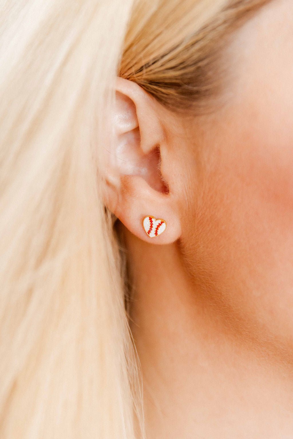 LINNY CO Baseball Gold screwback stud earrings for kids & little girls — hypoallergenic, waterproof stainless steel with secure screwback backs, shown on model.