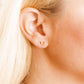 LINNY CO Billie Butterfly Gold screwback stud earrings for kids & little girls — hypoallergenic, waterproof stainless steel with secure screwback backs, shown on model.