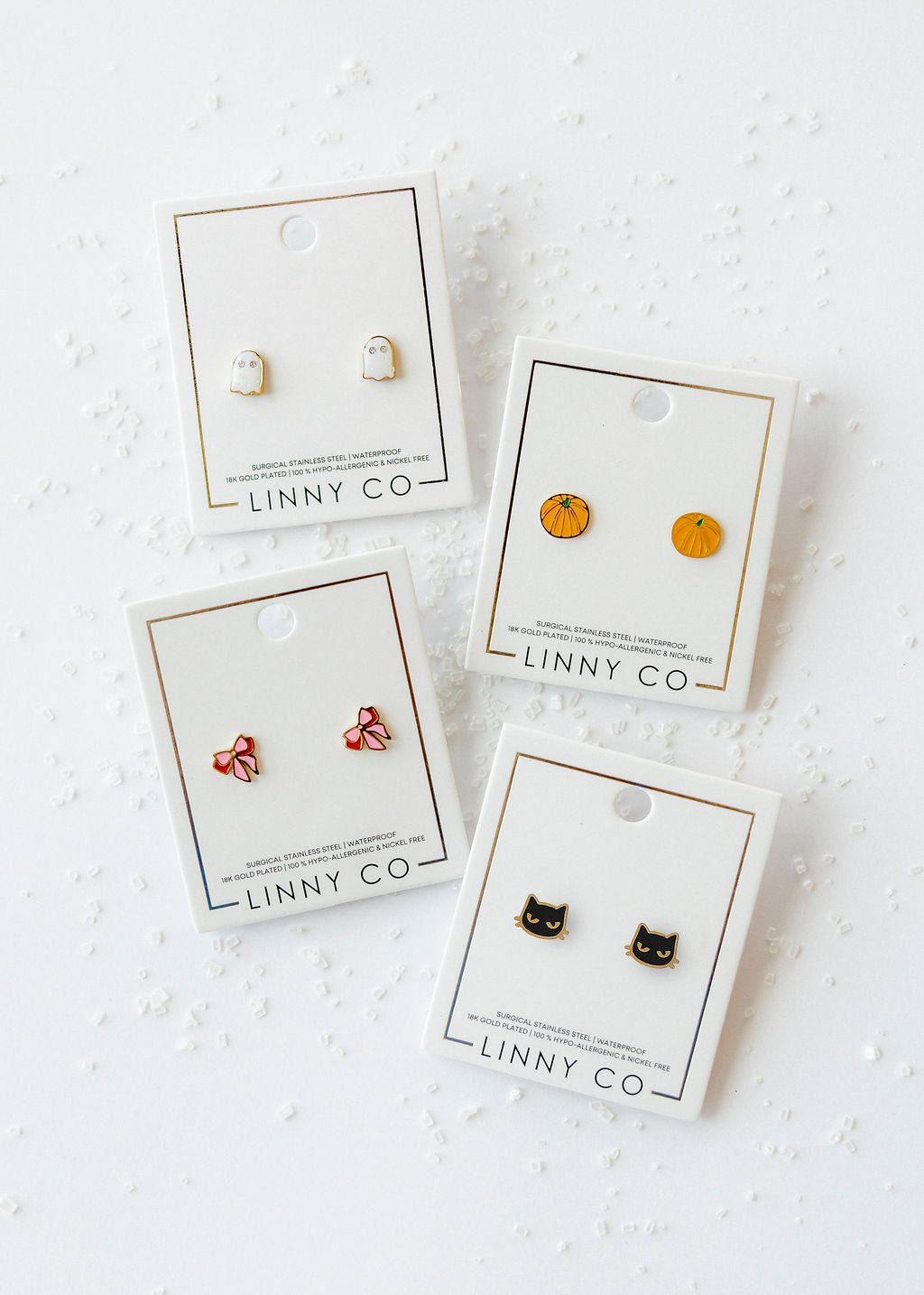 LINNY CO Black Cat screwback stud earrings for kids & little girls — hypoallergenic, waterproof stainless steel with secure screwback backs, flat-lay styling.