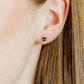 LINNY CO Black Cat screwback stud earrings for kids & little girls — hypoallergenic, waterproof stainless steel with secure screwback backs, shown on model.