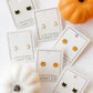 LINNY CO Black Cat screwback stud earrings for kids & little girls — hypoallergenic, waterproof stainless steel with secure screwback backs, shown on model.