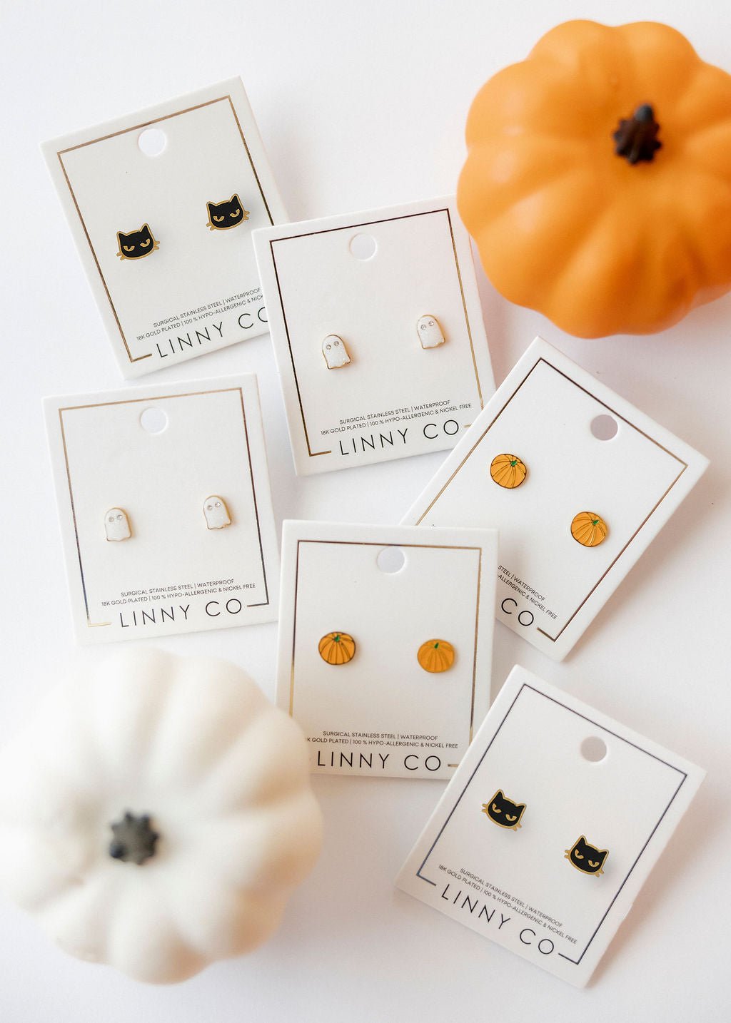 LINNY CO Black Cat screwback stud earrings for kids & little girls — hypoallergenic, waterproof stainless steel with secure screwback backs, shown on model.