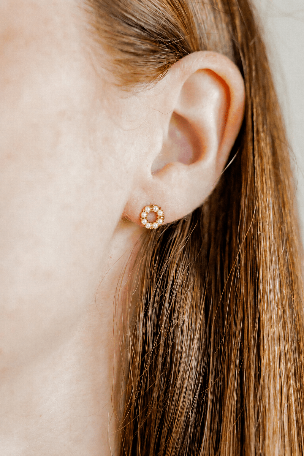 LINNY CO Brinley Pearl screwback stud earrings for kids & little girls — hypoallergenic, waterproof stainless steel with secure screwback backs, shown on model.