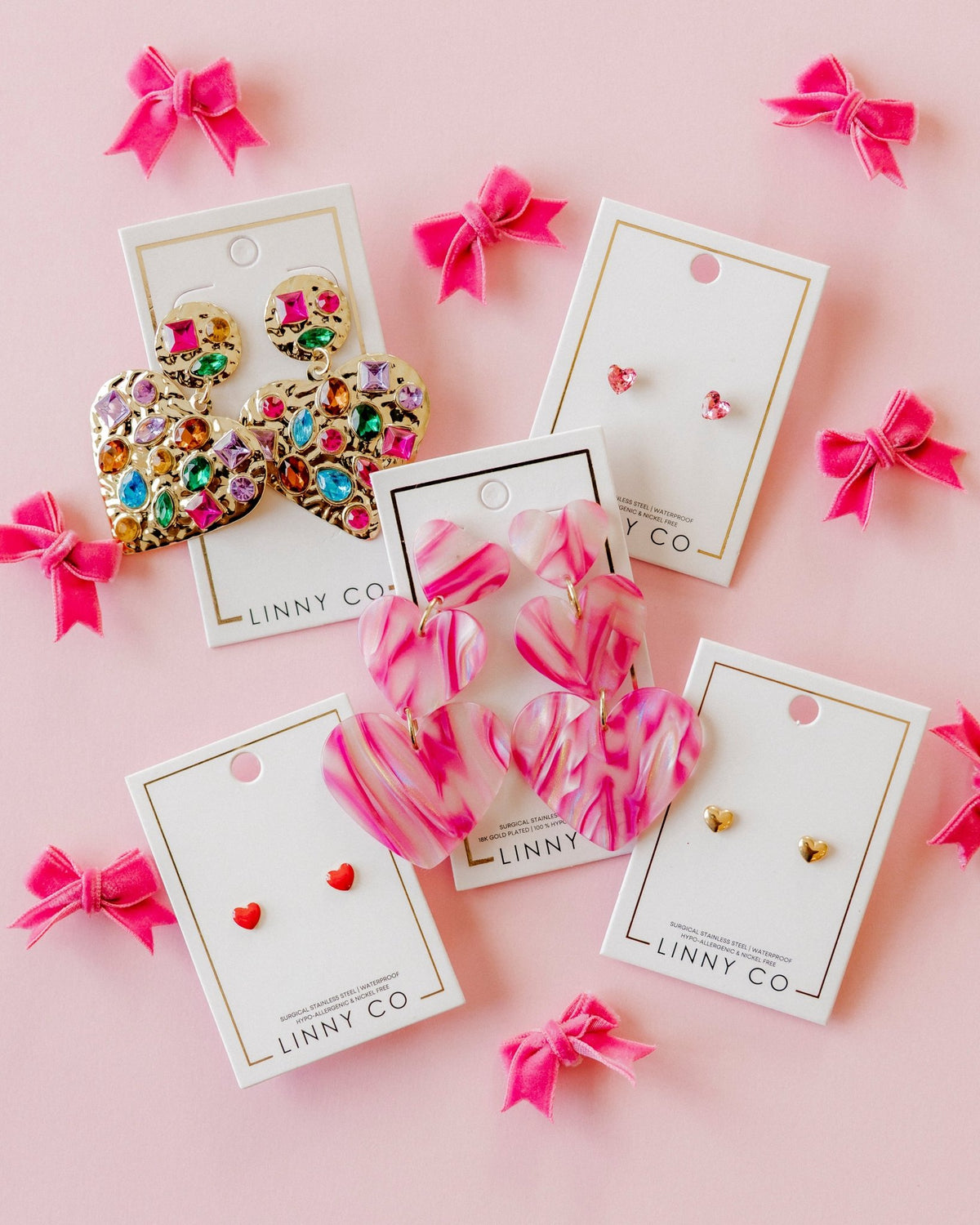 LINNY CO Hadley Gold screwback stud earrings for kids & little girls — hypoallergenic, waterproof stainless steel with secure screwback backs, flat-lay styling.