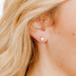 LINNY CO Juliet Clear 5mm screwback stud earrings for kids & little girls — hypoallergenic, waterproof stainless steel with secure screwback backs, shown on model.