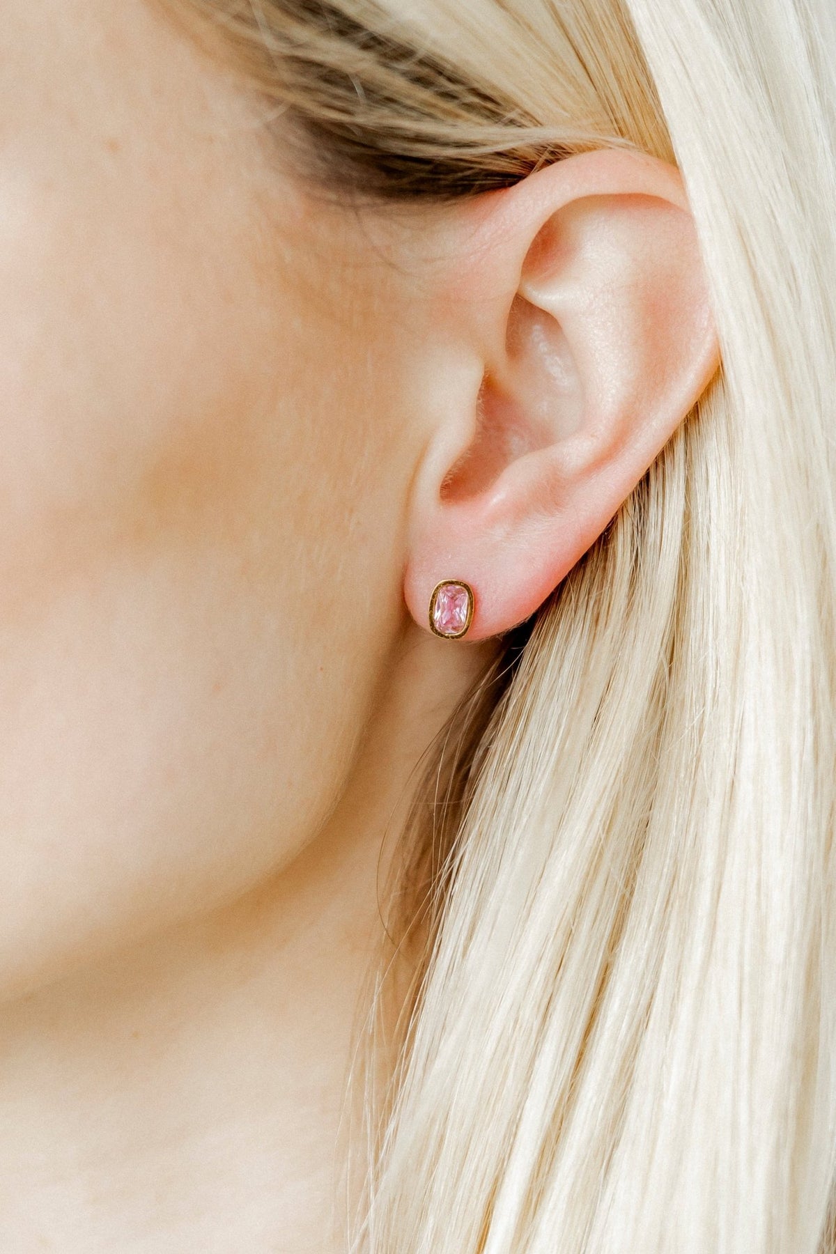 LINNY CO Kay Pink screwback stud earrings for kids & little girls — hypoallergenic, waterproof stainless steel with secure screwback backs, shown on model.