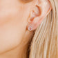 LINNY CO Lainey Silver screwback stud earrings for kids & little girls — hypoallergenic, waterproof stainless steel with secure screwback backs, shown on model.