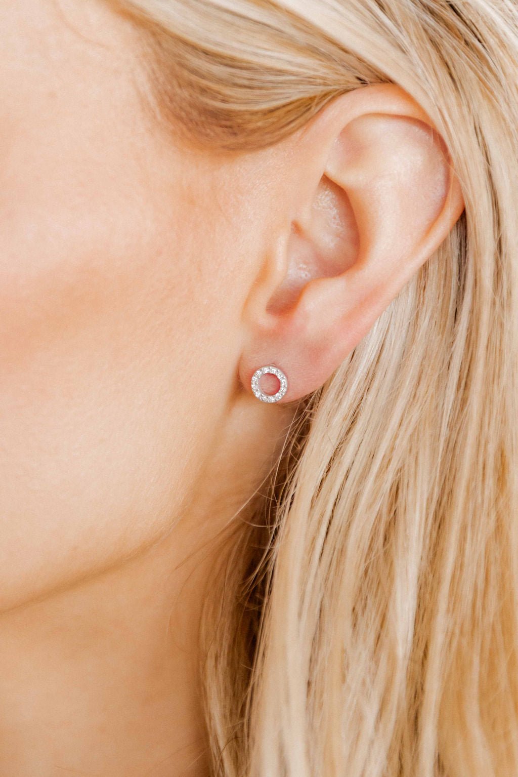 LINNY CO Lainey Silver screwback stud earrings for kids & little girls — hypoallergenic, waterproof stainless steel with secure screwback backs, shown on model.