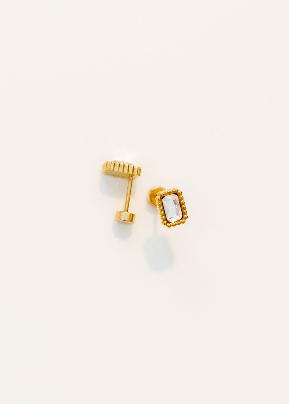 LINNY CO Madison Gold Clear screwback stud earrings for kids & little girls — hypoallergenic, waterproof stainless steel with secure screwback backs, flat-lay styling.