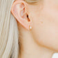 LINNY CO Maeve screwback stud earrings for kids & little girls — hypoallergenic, waterproof stainless steel with secure screwback backs, shown on model.