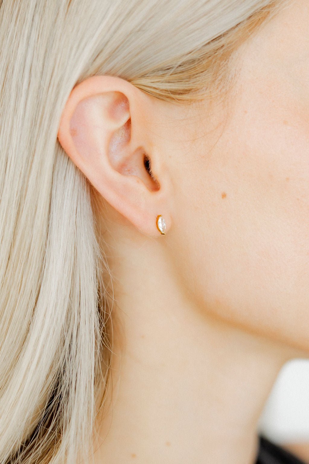 LINNY CO Maeve screwback stud earrings for kids & little girls — hypoallergenic, waterproof stainless steel with secure screwback backs, shown on model.