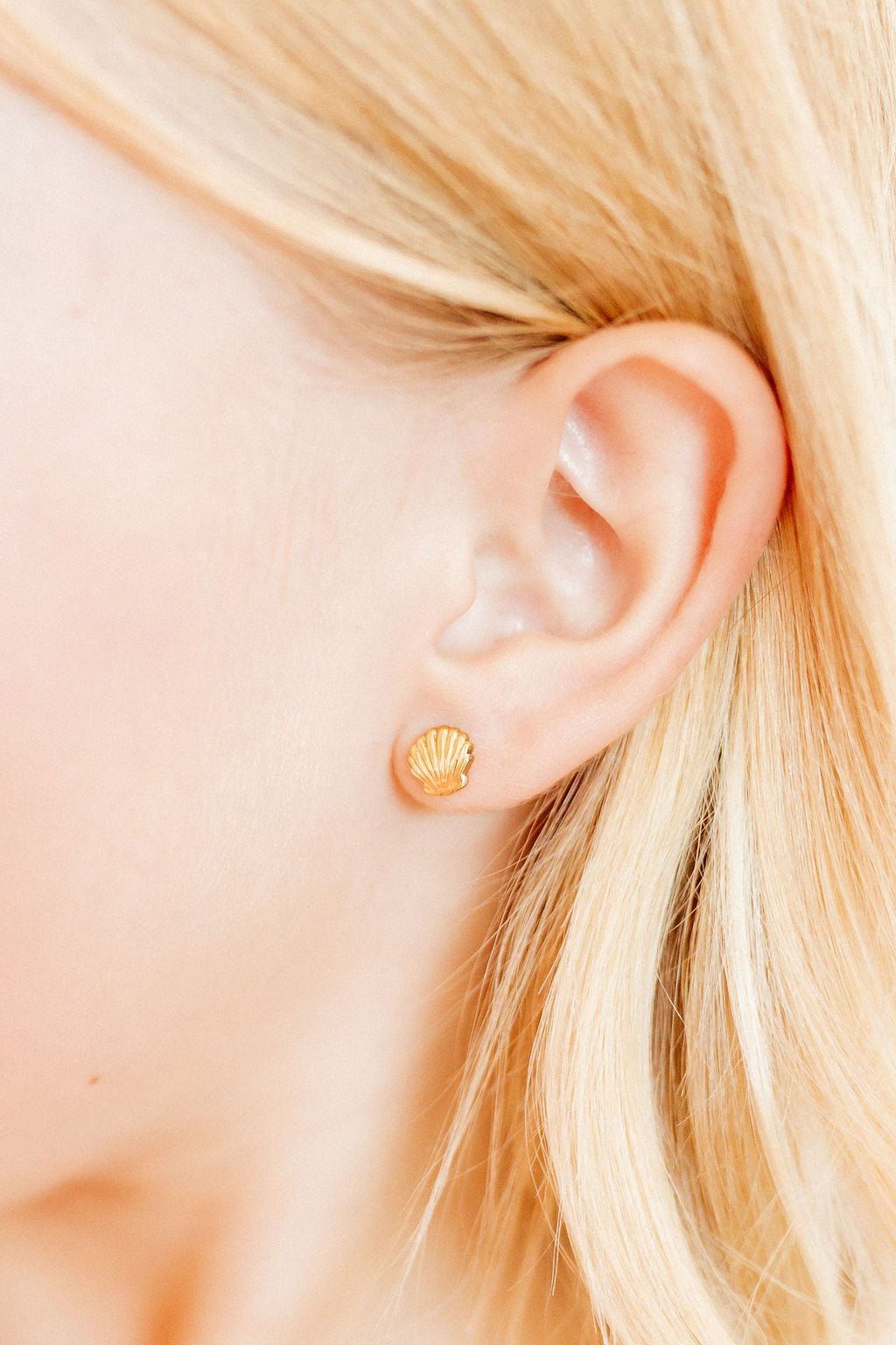 LINNY CO Marina Shell screwback stud earrings for kids & little girls — hypoallergenic, waterproof stainless steel with secure screwback backs, shown on model.