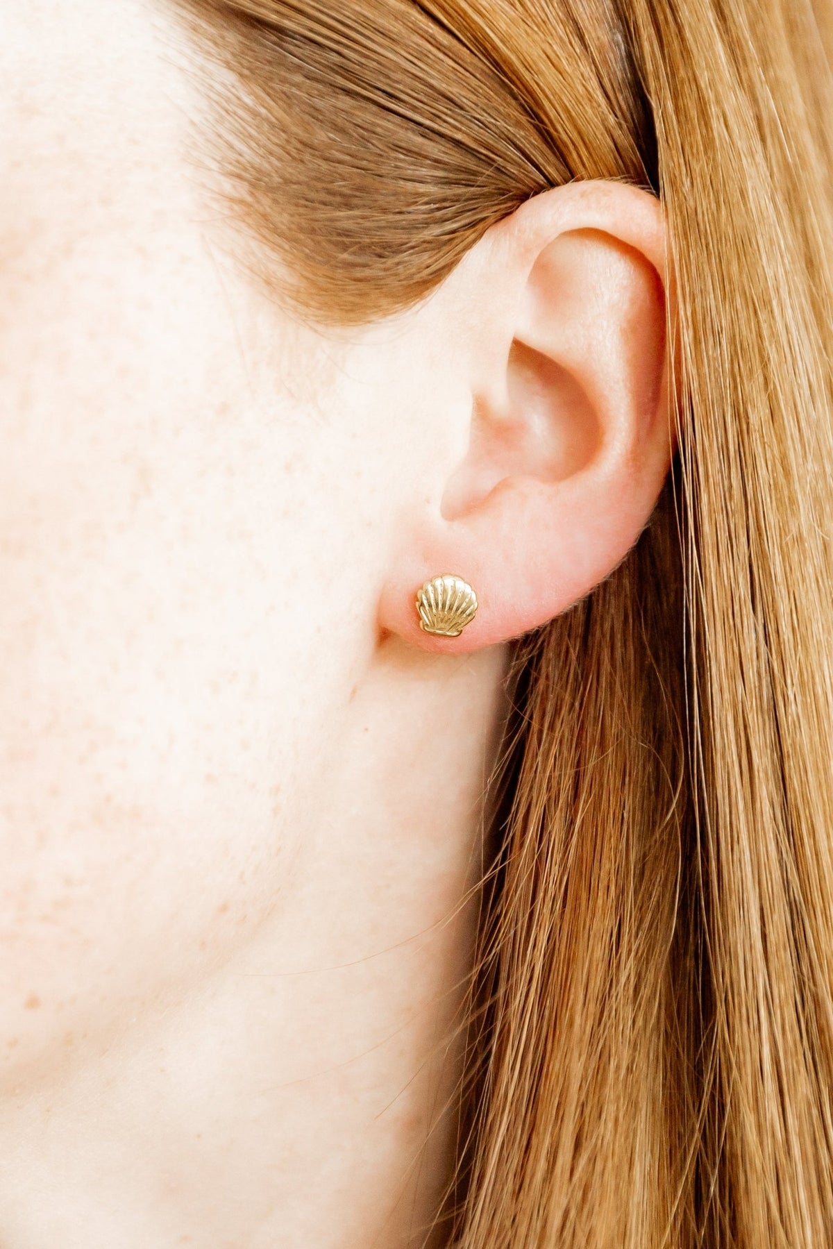 LINNY CO Marina Shell screwback stud earrings for kids & little girls — hypoallergenic, waterproof stainless steel with secure screwback backs, shown on model.