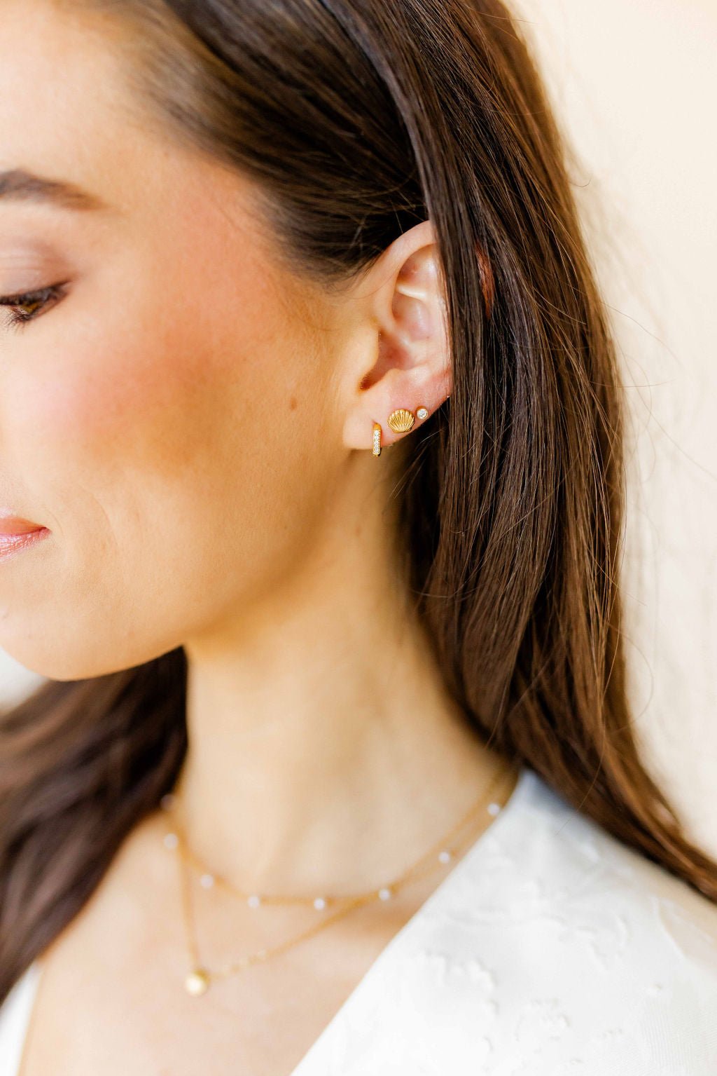LINNY CO Marina Shell screwback stud earrings for kids & little girls — hypoallergenic, waterproof stainless steel with secure screwback backs, shown on model.