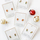 LINNY CO Merritt Ornament screwback stud earrings for kids & little girls — hypoallergenic, waterproof stainless steel with secure screwback backs, flat-lay styling.