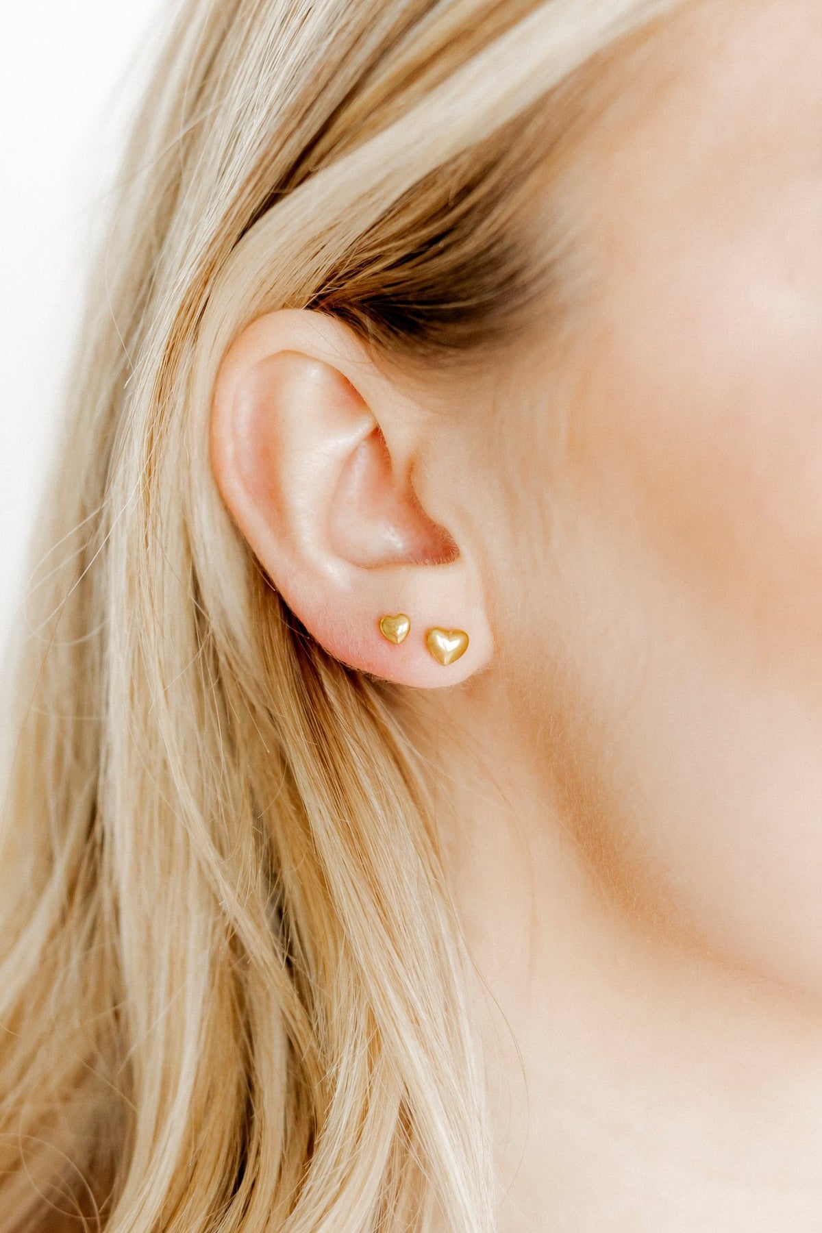 LINNY CO Micro Hadley screwback stud earrings for kids & little girls — hypoallergenic, waterproof stainless steel with secure screwback backs, shown on model.