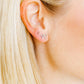 LINNY CO Micro Tally Silver screwback stud earrings for kids & little girls — hypoallergenic, waterproof stainless steel with secure screwback backs, shown on model.