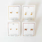 LINNY CO Millie Butterfly screwback stud earrings for kids & little girls — hypoallergenic, waterproof stainless steel with secure screwback backs, flat-lay styling.