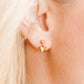 LINNY CO Millie Butterfly screwback stud earrings for kids & little girls — hypoallergenic, waterproof stainless steel with secure screwback backs, shown on model.