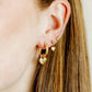 LINNY CO Millie Heart Gold screwback stud earrings for kids & little girls — hypoallergenic, waterproof stainless steel with secure screwback backs, shown on model.