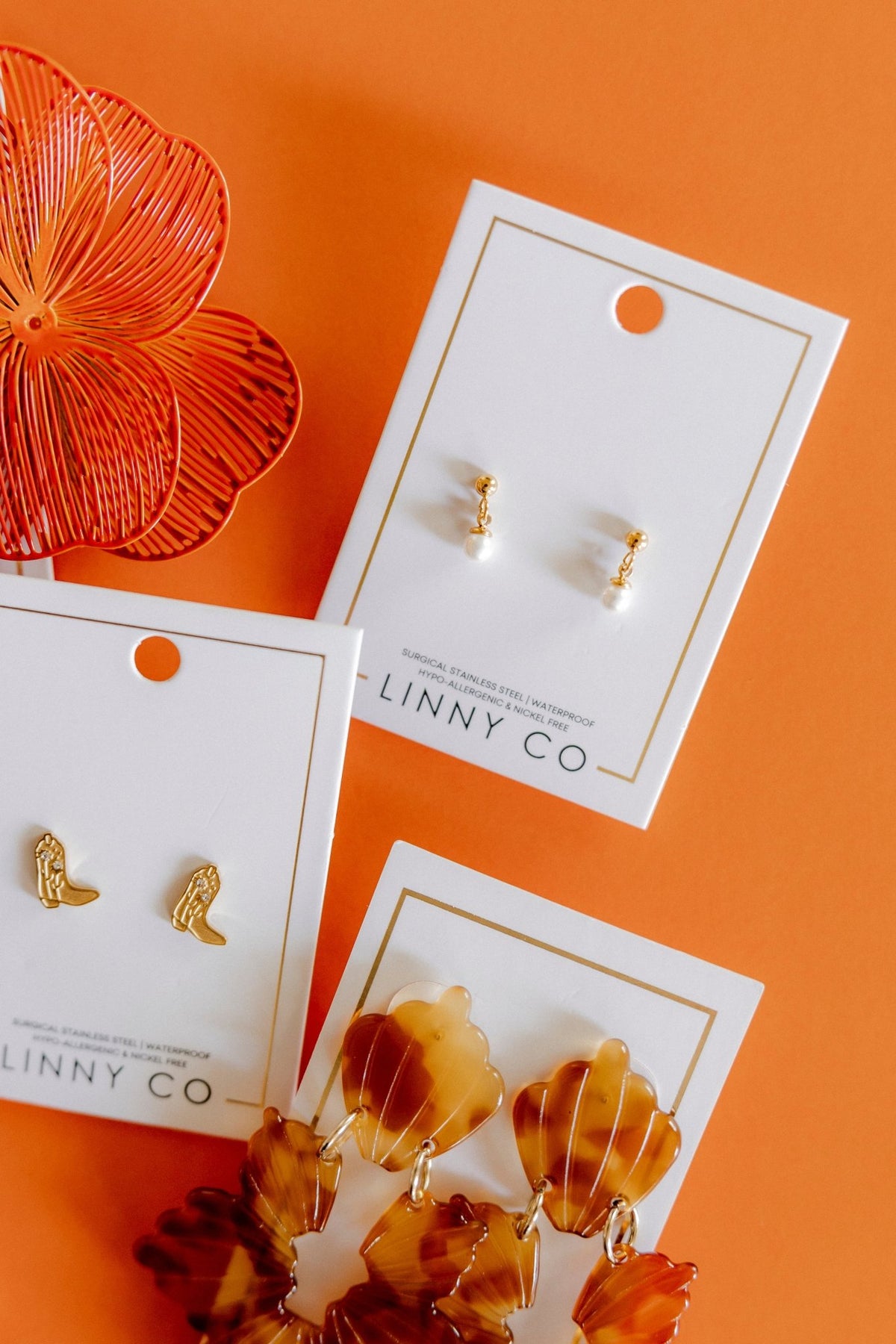LINNY CO Millie Pearl Gold screwback stud earrings for kids & little girls — hypoallergenic, waterproof stainless steel with secure screwback backs, flat-lay styling.