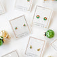 LINNY CO Noelle screwback stud earrings for kids & little girls — hypoallergenic, waterproof stainless steel with secure screwback backs, flat-lay styling.