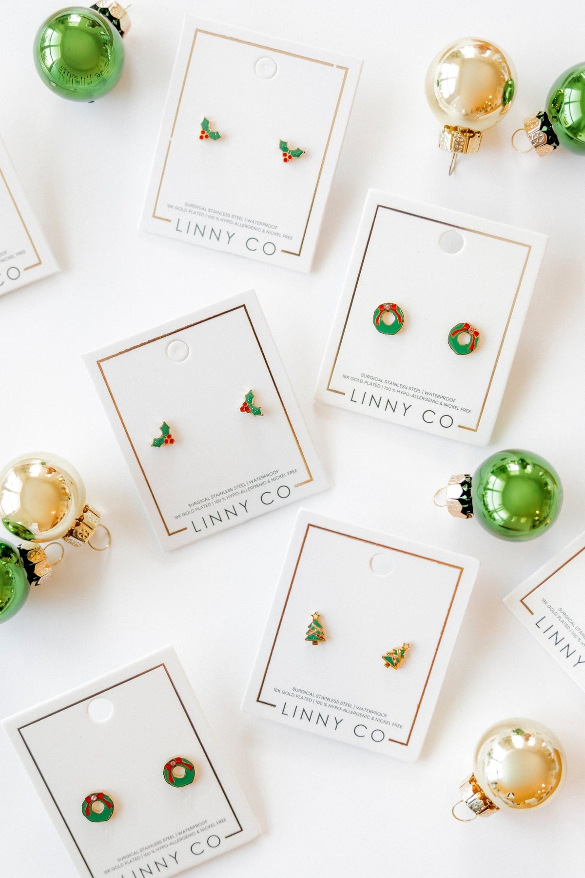 LINNY CO Noelle screwback stud earrings for kids & little girls — hypoallergenic, waterproof stainless steel with secure screwback backs, flat-lay styling.