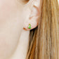 LINNY CO Noelle screwback stud earrings for kids & little girls — hypoallergenic, waterproof stainless steel with secure screwback backs, shown on model.