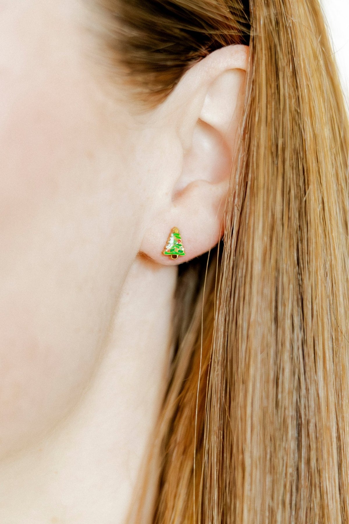 LINNY CO Noelle screwback stud earrings for kids & little girls — hypoallergenic, waterproof stainless steel with secure screwback backs, shown on model.
