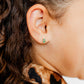 LINNY CO Noelle screwback stud earrings for kids & little girls — hypoallergenic, waterproof stainless steel with secure screwback backs, shown on model.