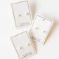 LINNY CO Payton Pearl White 5mm screwback stud earrings for kids & little girls — hypoallergenic, waterproof stainless steel with secure screwback backs, flat-lay styling.