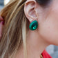 LINNY CO Poppy screwback stud earrings for kids & little girls — hypoallergenic, waterproof stainless steel with secure screwback backs, shown on model.