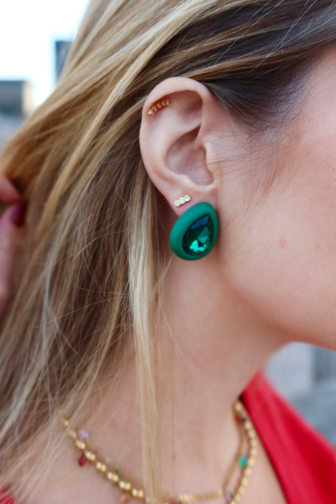 LINNY CO Poppy screwback stud earrings for kids & little girls — hypoallergenic, waterproof stainless steel with secure screwback backs, shown on model.