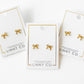 LINNY CO Sadie Bow Gold screwback stud earrings for kids & little girls — hypoallergenic, waterproof stainless steel with secure screwback backs, flat-lay styling.