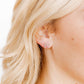 LINNY CO Sadie Bow Silver screwback stud earrings for kids & little girls — hypoallergenic, waterproof stainless steel with secure screwback backs, shown on model.