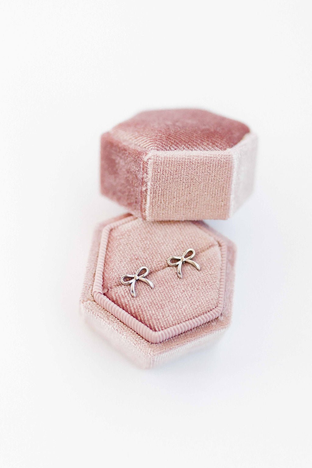 LINNY CO Sadie Bow Silver screwback stud earrings for kids & little girls — hypoallergenic, waterproof stainless steel with secure screwback backs, detail.