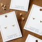 LINNY CO Texas Steer Gold screwback stud earrings for kids & little girls — hypoallergenic, waterproof stainless steel with secure screwback backs, shown on model.